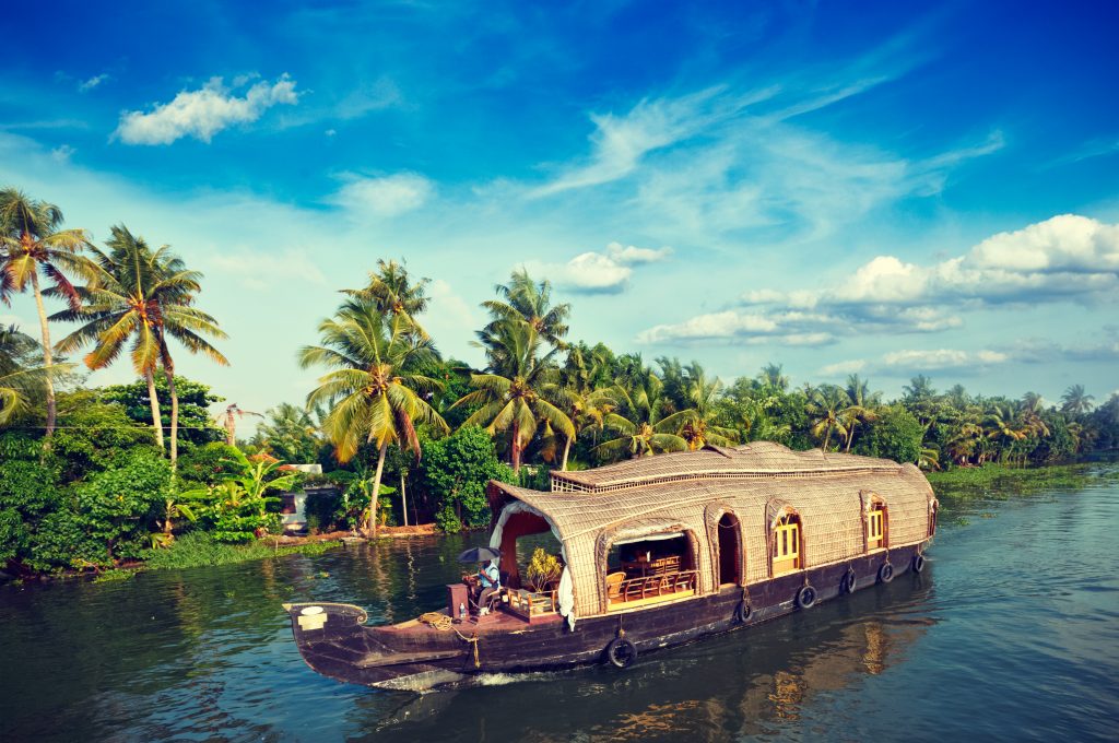 Houseboat on Kerala backwaters, India Vintage retro hipster style travel image of Kerala travel tourism background - houseboat on Kerala backwaters. Kerala, India